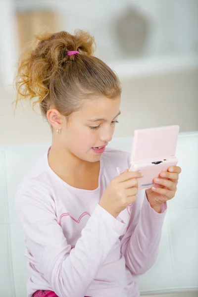 Young Girl Using Portable Console — Stock Photo, Image