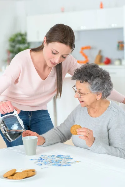 Senior Woman Getting Helped Her Breakfast — Stok fotoğraf