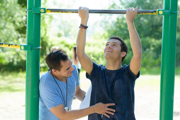 Young Athletic Man Doing Exercises Outdoors — Stock Photo, Image