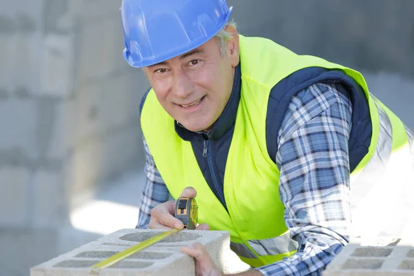 Worker Measuring Wall — Stock Photo, Image