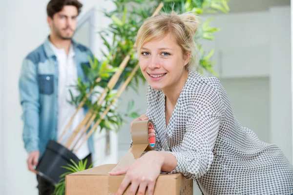 Woman Taping Boxes Moving New Apartment — Stock Photo, Image