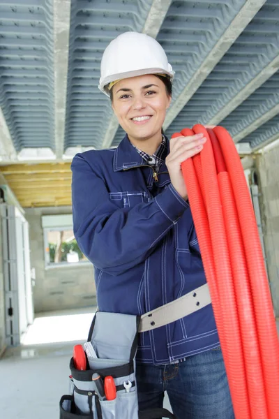 woman engineer with plastic pipes