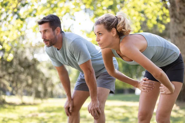 Couple Bent Getting Breath Back Exercising — Stock Photo, Image