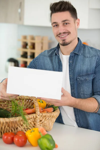 Handsome Young Man Holding Blank Panel — Stock Photo, Image