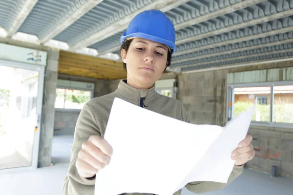 Female Construction Site Engineer Looking Blueprint — Foto Stock