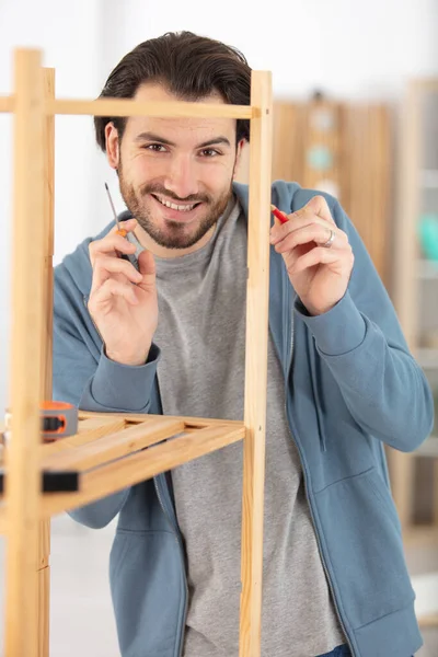 Young Man Tries Himself Assemble Furniture — Stock Photo, Image