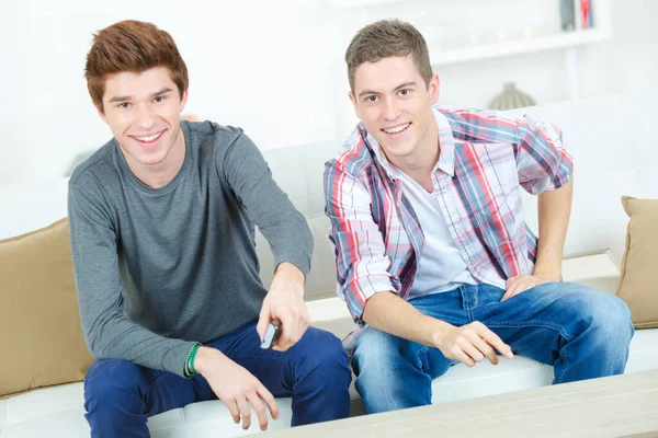 Young Men Holding Remote Control Watching — Stock Photo, Image