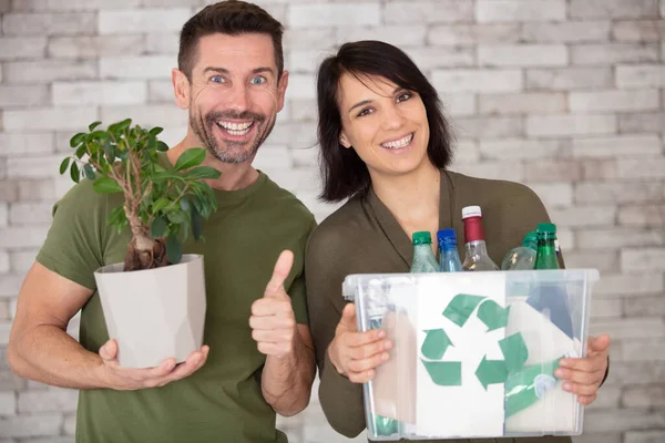 Happy Couple Hold Plastic Container Plant Thumbs — Stock Photo, Image