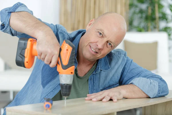 Man Drilling Hole Wooden Plank — Stock Photo, Image