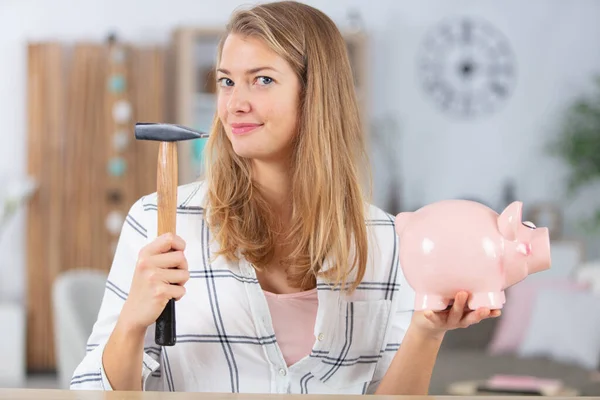Young Smiling Woman Breaks Porcelain Piggy Bank — Stock Photo, Image
