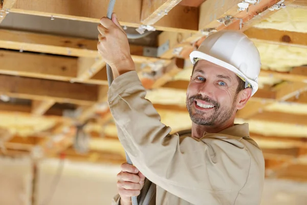 Male Electrician Installing Cabling Roof — Stock Photo, Image
