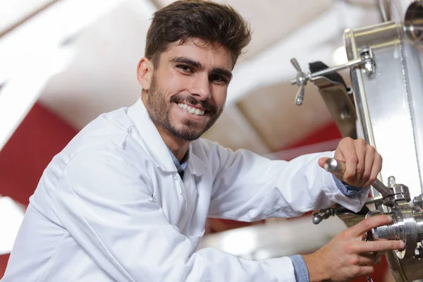 Confident Young Technician Operating Machine Modern Brewery — Stock Photo, Image
