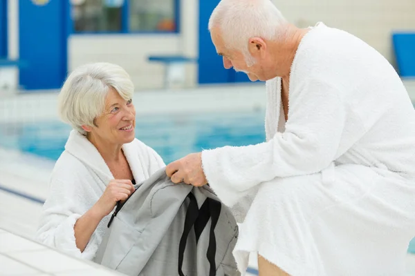 Happy Senior Couple Bathrobe Resort Pool — Stock Photo, Image