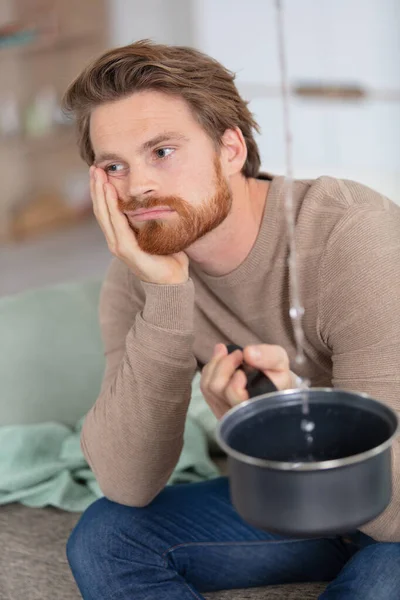 Worried Man Unhappy Water Falling Bucket Home — Stock Photo, Image