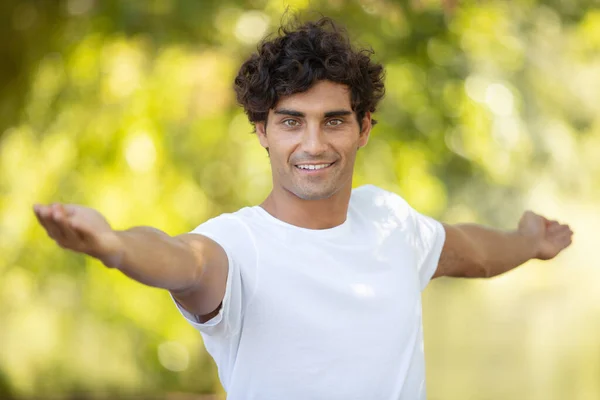 Confident Muscular Man Stretching His Arms — Stock Photo, Image