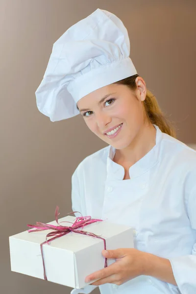 Bakery Worker Holding Out Box — Stock Photo, Image
