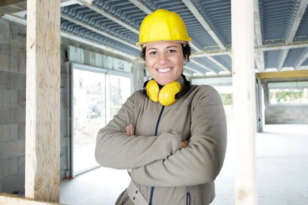 woman contractor worker with noise cancelling headphones