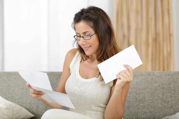 Happy Woman Reading Letter Home — Stock Photo, Image