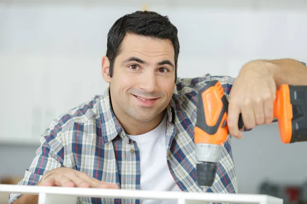 Happy Man Using Drill Home — стоковое фото