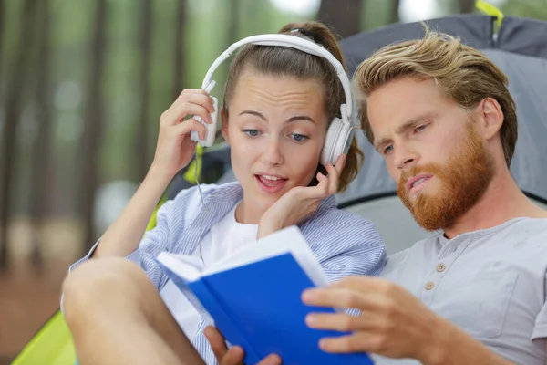 Happy Couple Sitting Tent Reading Book — Stock Photo, Image