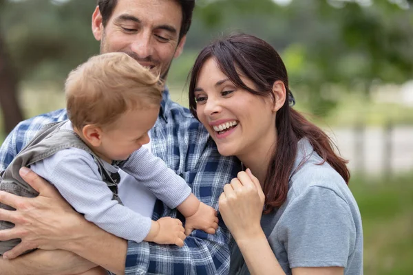 Family Walking Field Carrying Young Baby Son — Stock Photo, Image