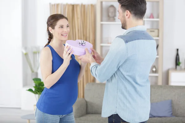Husband Offers Wife Pregnant Gift — Stock Photo, Image