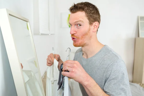 Tman Holding Clothes Hanger Front Mirror — Stock Photo, Image