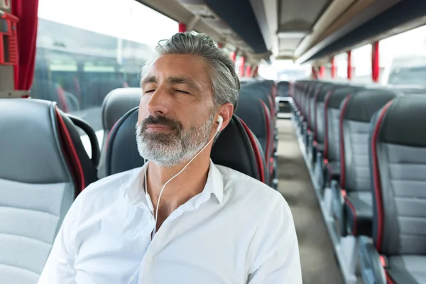 man sleeping in travel bus