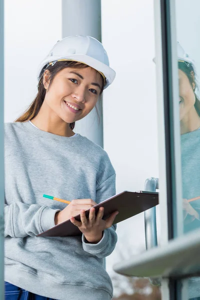 stock image Portrait of asian lady holding clipboard