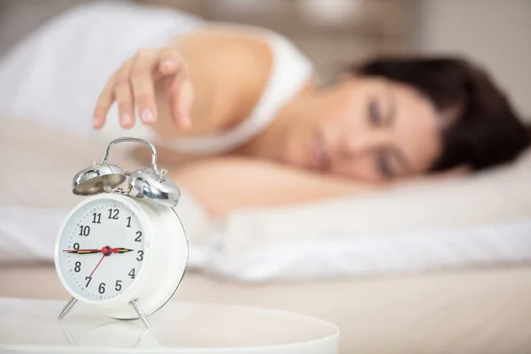 Woman Bed Reaching Hand Alarm Clock — Stock Photo, Image
