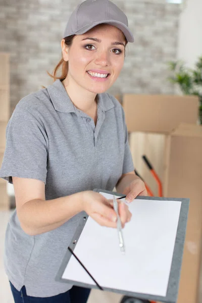 Smiling Young Delivery Woman Holding Cardboard Box — Stock Photo, Image