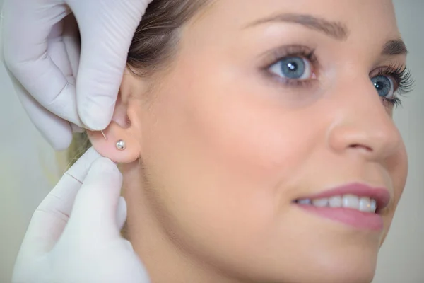 Woman Putting Extra Earrings — Stock Photo, Image