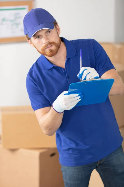 Portrait Delivery Man Unloading Cardboard Boxes — Stock Photo, Image