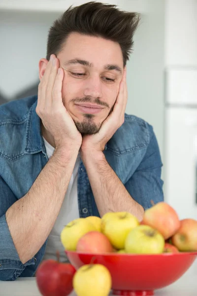 Man Looking Longingly Bowl Apples — Stock Photo, Image
