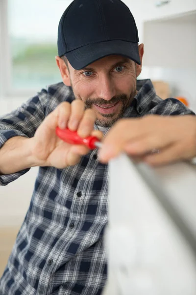 Male Technician Installing Oven Kitchen — Stock Photo, Image