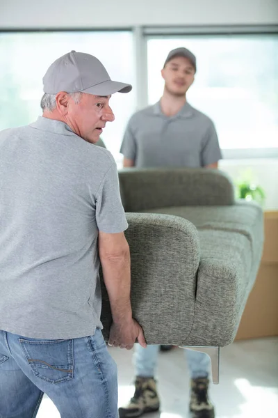 Delivery Men Moving Sofa New Home — Stock Photo, Image