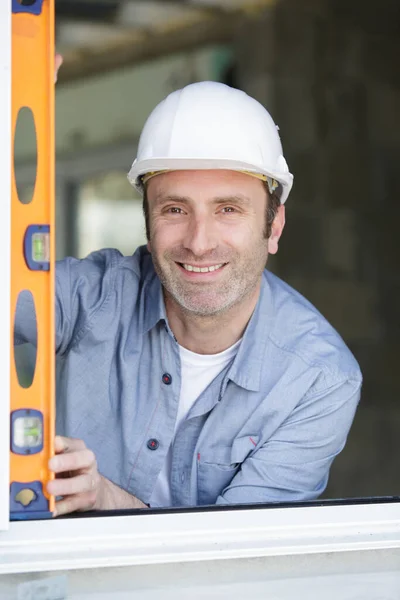 Happy Worker Standing House Holding Level — Stock Photo, Image
