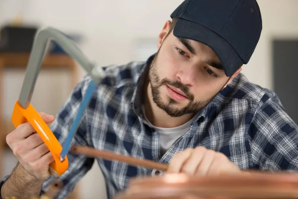 Man Cutting Cooper Pipes — Stock Photo, Image