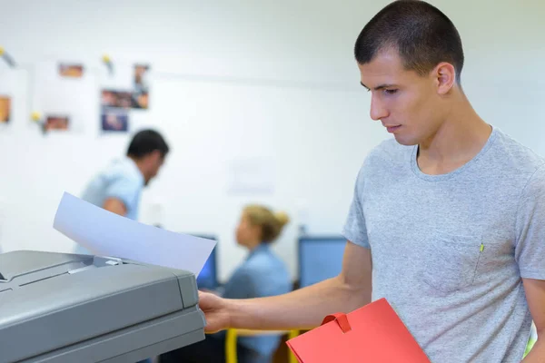Male Student Printing Document — Stock Photo, Image
