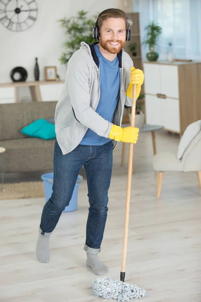 Young Man Mopping Floor Home — Stock Photo, Image