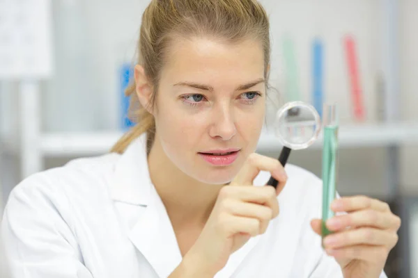 Woman Doctor Holding Magnifying Glass Analysis Test Tubes — Stock Photo, Image