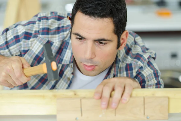 Carpenter Hammering Nail Wooden Plank — Stock Photo, Image