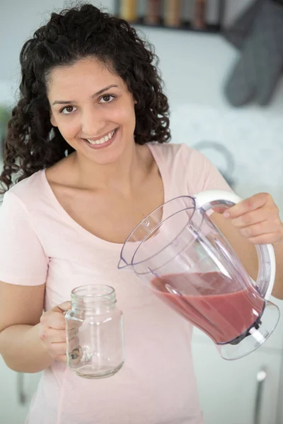 Beautiful Young Woman Pouring Juice Glass — Stock Photo, Image
