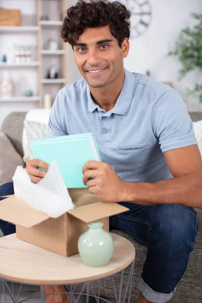 Man Opening Delivery Books — Stock Photo, Image