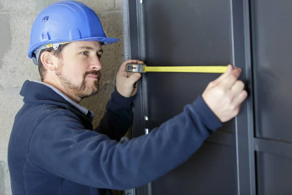 Construction Worker Measuring Width Door Frame — Stock Photo, Image