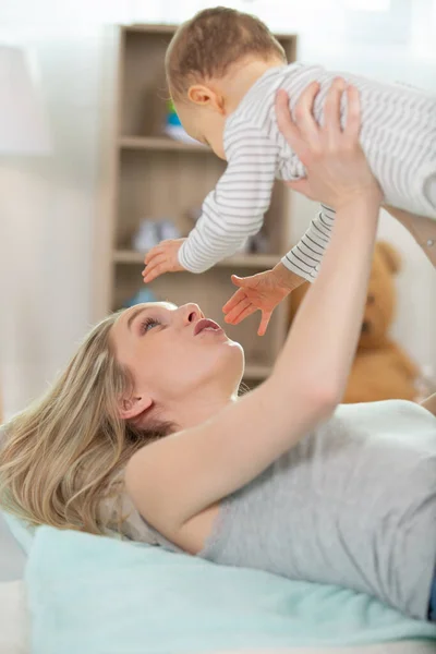 Young Mother Holding Her Baby Bedroom — Stock Photo, Image