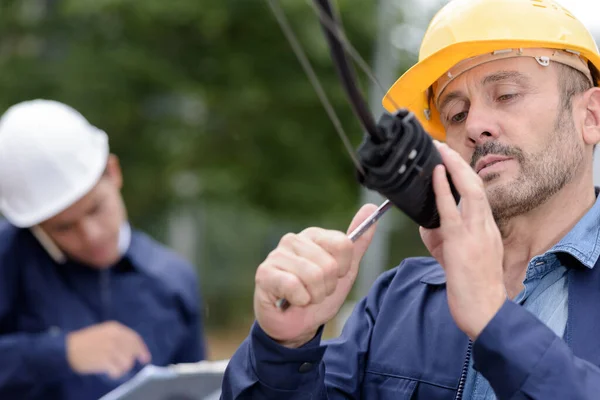 Male Technician Repairing Something Outdoor — Stock Photo, Image