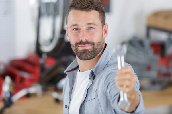Man Wrench Looking Camera — Stock Photo, Image