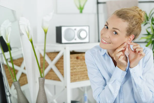 Smiling Young Woman Trying Earrings Home — Stock Photo, Image