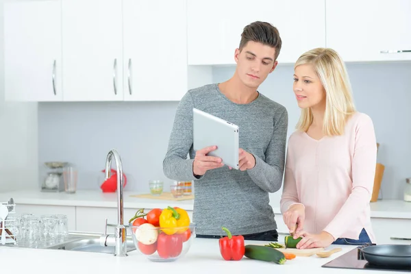 Young Couple Kitchen Looking Tablet — Stock Photo, Image